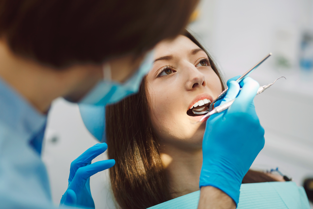 Patient smiling during dental checkup – Ideal Dental Houston TX