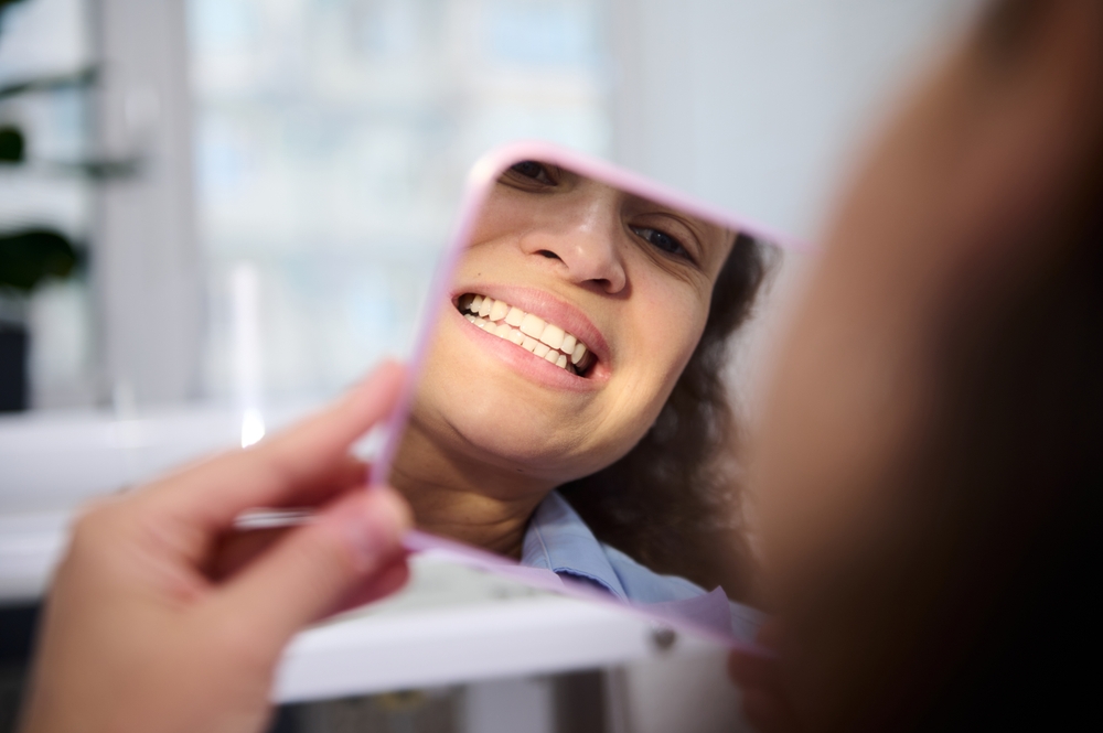 Patient smiling during dental checkup – Ideal Dental Houston TX