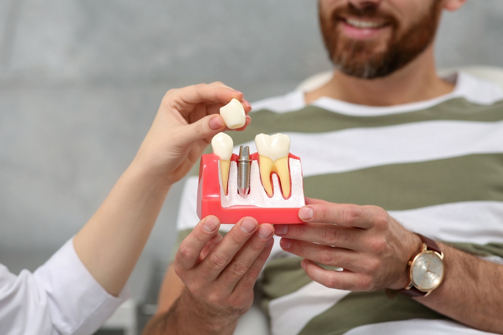 Patient smiling during dental checkup – Ideal Dental Houston TX