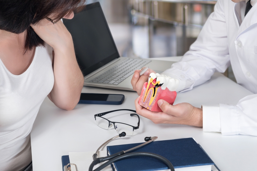 Patient smiling during dental checkup – Ideal Dental Houston TX