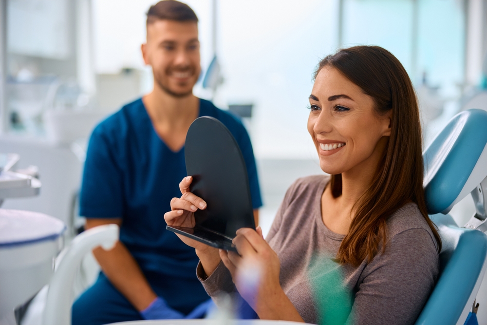 Patient smiling during dental checkup – Ideal Dental Houston TX