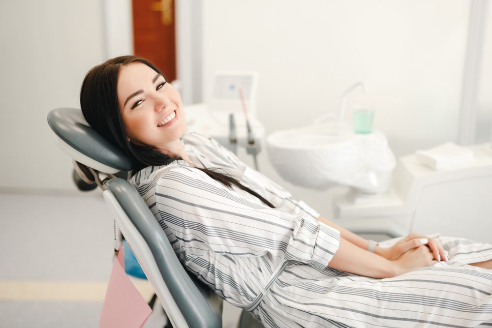 Patient smiling during dental checkup – Ideal Dental Houston TX