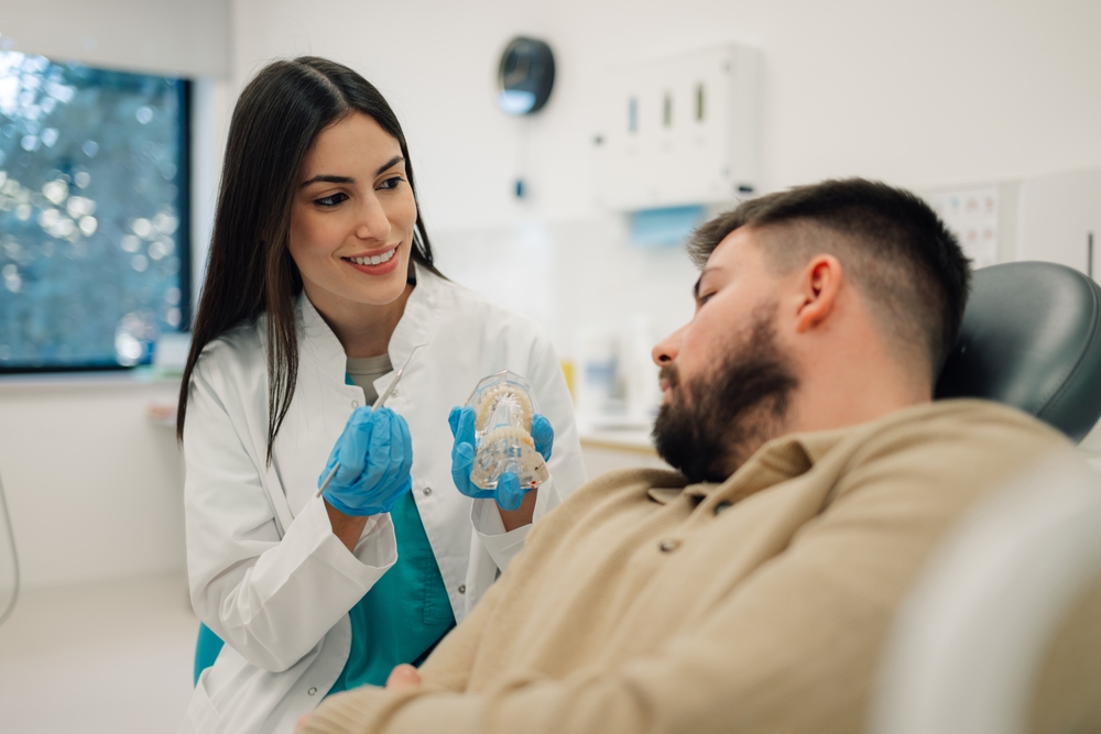 Patient smiling during dental checkup – Ideal Dental Houston TX