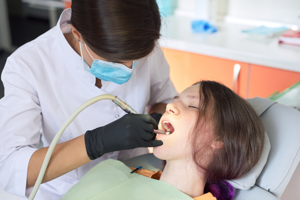 Dr. Chiara Combs, DDS smiling in dental office – Ideal Smiles Family Dentistry