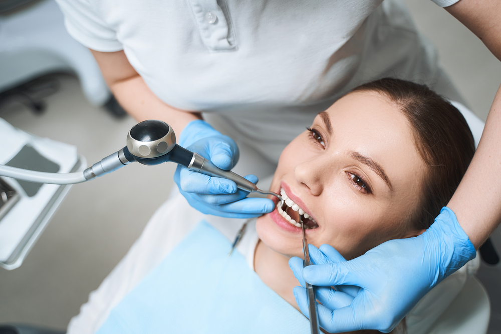 Patient smiling during dental checkup – Ideal Dental Houston TX