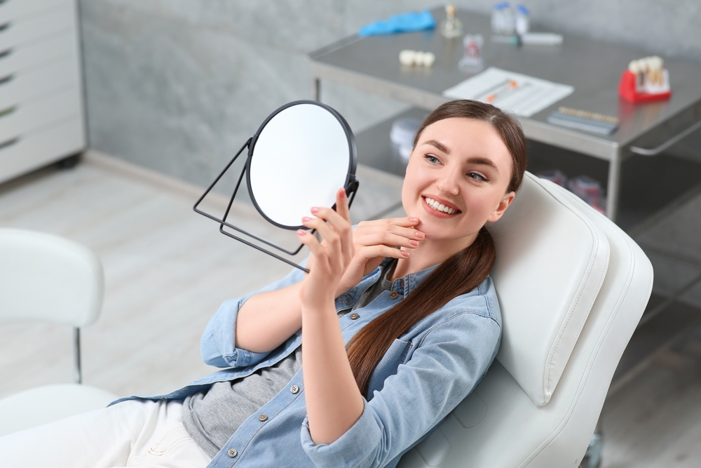 Patient smiling during dental checkup – Ideal Dental Houston TX