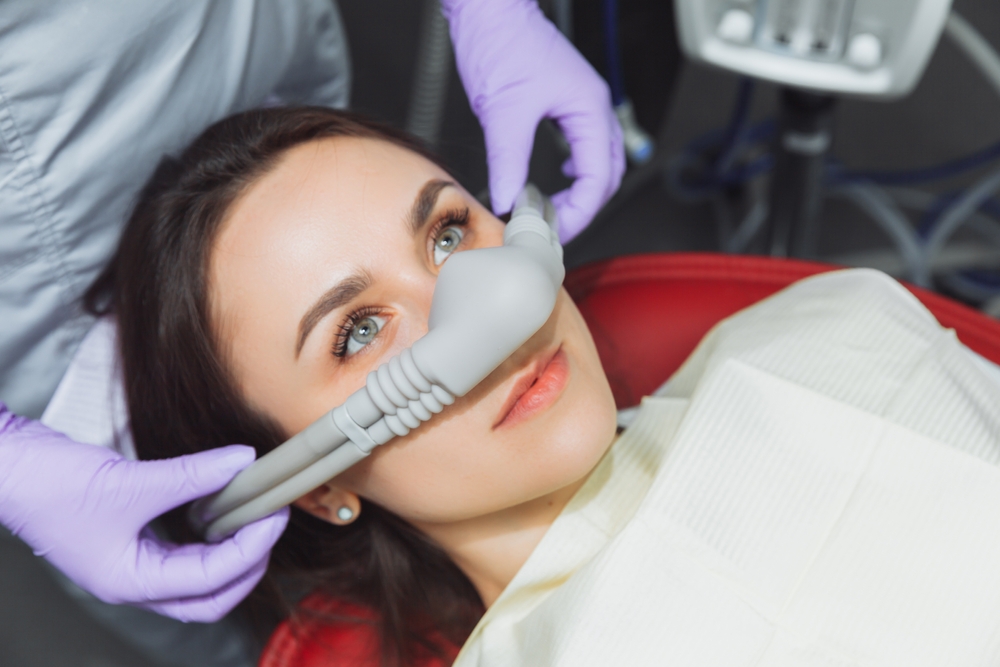 Patient smiling during dental checkup – Ideal Dental Houston TX