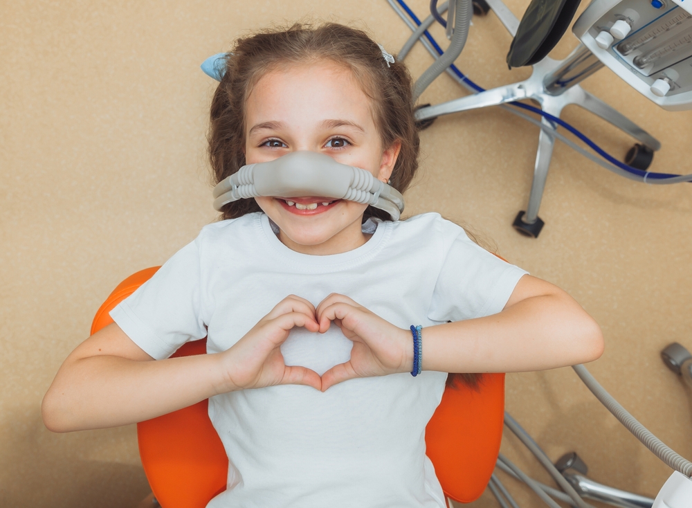 Patient smiling during dental checkup – Ideal Dental Houston TX