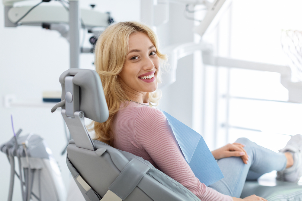 Patient smiling during dental checkup – Ideal Dental Houston TX